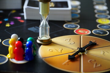 Colourful play figures on board. The board game. Team game, team work, team job, limited time, time is over. It is time to play.