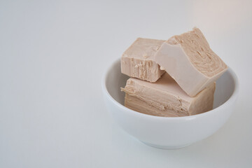 A stick of fresh yeast (brewer's yeast), used for bread and pizza doughs                              