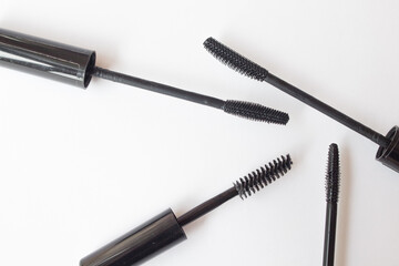 Set of mascara brushes on a white background. spa and makeup concept. Top view. Flat lay composition