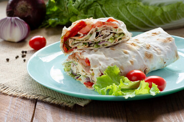 Shawarma with chicken and vegetables on a plate