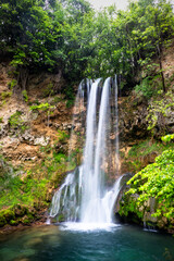 Fototapeta premium Waterfall in a forest on a clean and speed river. Veliki Buk in Lisine, Serbia.