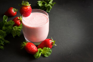 Strawberry smoothie, fresh berries,  healthy eating, dieting food, black background.