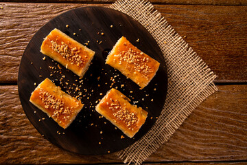 Turkish Dessert Kadayif on wood background.