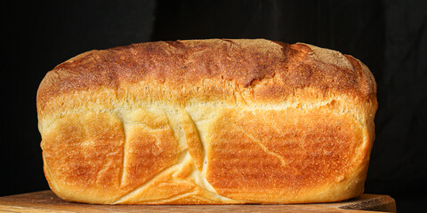 bread white golden fresh wheat baking. food background top view copy space for text