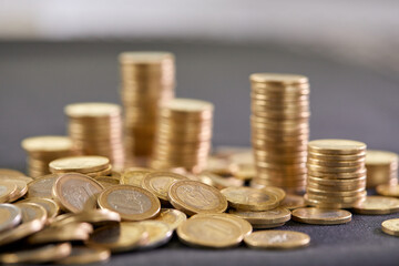 Stock Photo - Euro coins. Euro money. Euro currency.Coins stacked on each other in different positions. Money concept