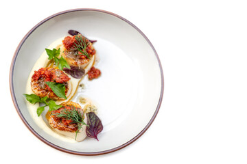 cream salad and oil on the streaming fresh scallop in white dish is the one of main course for the...