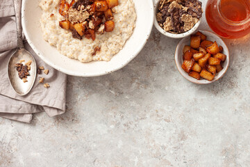 Oatmeal Porridge with caramel apples and pecans. Healthy Breakfast