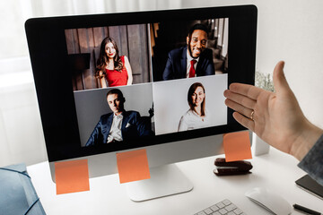 Fototapeta na wymiar Zoom conference. Business partners communicate via video using laptop. 