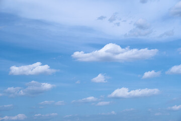 Naklejka na ściany i meble Bright beautiful blue sky with soft clouds, bright sunny day