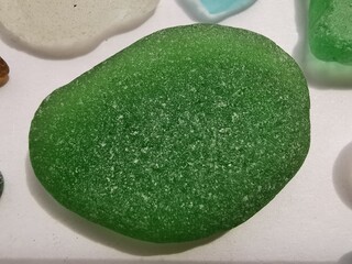 Sea glass close up photo. Small pieces of sea glass-shards, polished by the sea waves.