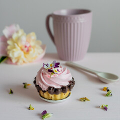 Pink peonie, cream cakes and flower tea