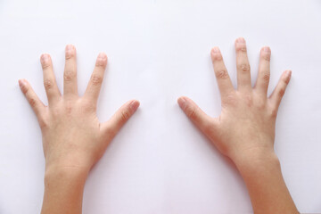 A 8 year old daughters hands on white paper