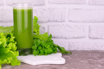 Green vitamin smoothie on the table. Copy space.