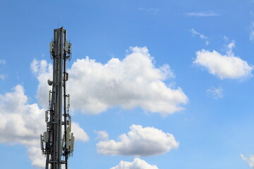 Antenna for communication Behind the blue sky and white clouds