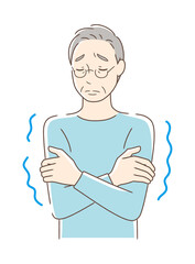 寒気を感じて震える男性
