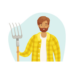 A young male farmer in a checked shirt with a haystack in his hands. The season of harvest. Grain growing and animal husbandry. Subsistence farming.