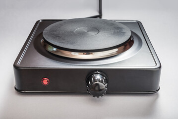 Fototapeta premium Black metal electric stove, mobile table hob
