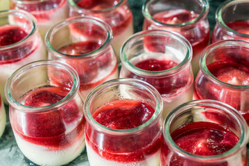 Berry yogurt in small jars for breakfast
