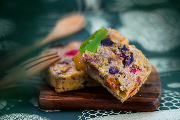 Fresh sliced homemade fruit cake with juicy candied fruits