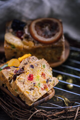 Fresh sliced homemade fruit cake with juicy candied fruits