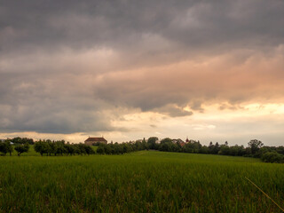 sunset in the field, sunset with dramatic clouds, landscape in Czech Republic
