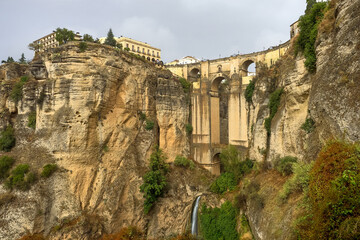 Fototapeta na wymiar Puente Nuevo in Ronda, Spain spans the 120m deep chasm which divides the city.