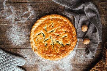 Fresh baked pie with spinach and cheese filling