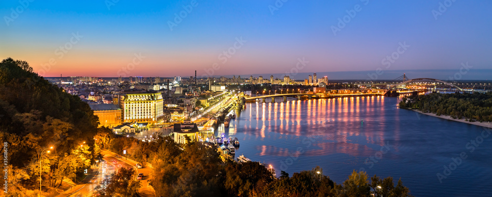 Wall mural cityscape of kiev with the dnieper at sunset. ukraine