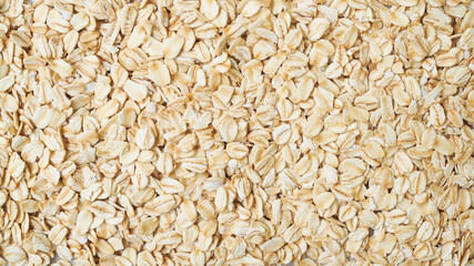 Wallpaper of Rolled oat flakes cereal whole grain background.