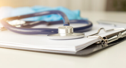 Close-Up of stethoscope and medical chart. medical concept
