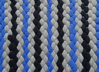 Abstract rhomb lines stripes zigzag chaotic pattern black gray blue color textile clothes surface background