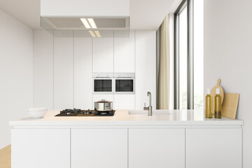 White kitchen unit, countertop and cabinets with built-in appliances in the background. 3d rendering.