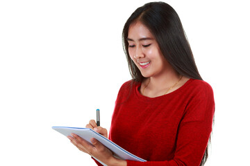 Young Asian woman holding book and taking note with smiling on white background