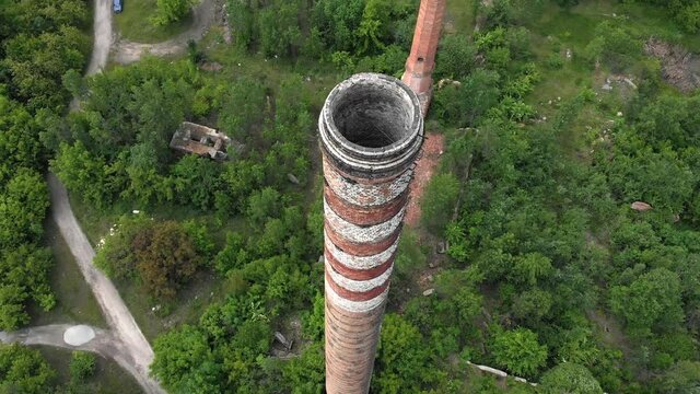 The ruins of an old factory top view. Smokestacks of an old factory. Abandoned ruins of a sugar factory.