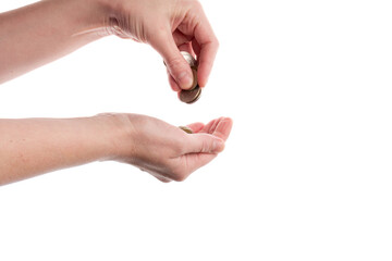 The coins in hand on white background, concept of calculating expenses, incomes and expenses.