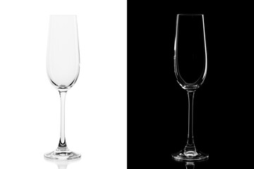 Empty champagne glass isolated on white and black background