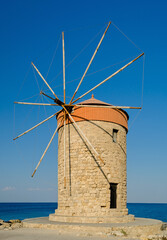 Fototapeta na wymiar One of the old windmills in Rhodes harbor, Greece