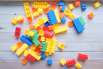 colorful building blocks on wooden table , top view 