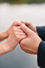Fototapeta premium Support for women, hands of a girl in the hands of a man, protection of girls