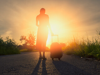 Fototapeta na wymiar Female travelers towing luggage for traveling