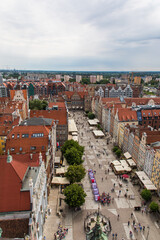 Fototapeta na wymiar Gdansk, Poland - Juny, 2019: Red roofs, old buildings and colorful houses in Old Town Stare Miasto in Gdansk, aerial view from cathedral St. Mary's Church tower, Poland