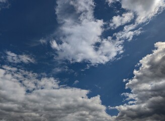 Fototapeta na wymiar Blue sky with white-gray thunderclouds. Kishinev. Moldova.