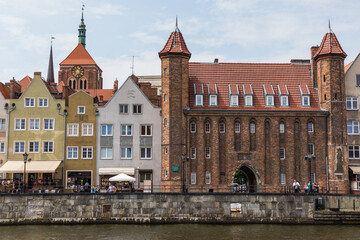 Obraz premium Gdansk, Poland - Juny, 2019. Gdansk old town and famous crane, Polish Zuraw. View from Motlawa river. The city also known as Danzig and the city of amber.