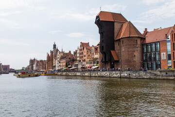 Gdansk, Poland - Juny, 2019. Gdansk old town and famous crane, Polish Zuraw. View from Motlawa river. The city also known as Danzig and the city of amber.