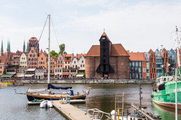 Gdansk, Poland - Juny, 2019. Gdansk old town and famous crane, Polish Zuraw. View from Motlawa river. The city also known as Danzig and the city of amber.