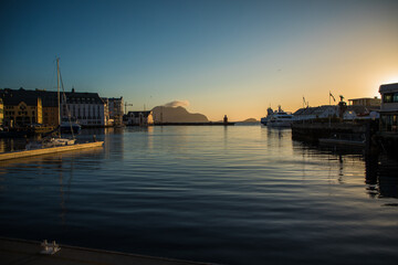 Fototapeta premium Gdansk, Poland - Juny, 2019: Scenic secessionist houses in european Alesund town reflected in water at Romsdal region in Norway