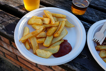 street food: french fries with ketchup and beer