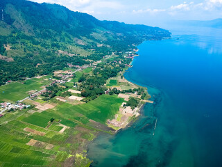Fototapeta na wymiar The beautiful aerial view of Lake Toba. Lake Toba is one of the tourist destinations in North Sumatra, Indonesia.