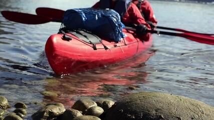 MS Man and woman sea kayaking in fjord in South Greenland / Narsaq, Greenland