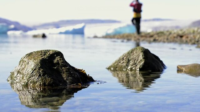 MS PAN Rocks reflecting in fjord in South Greenland / Narsaq, Greenland